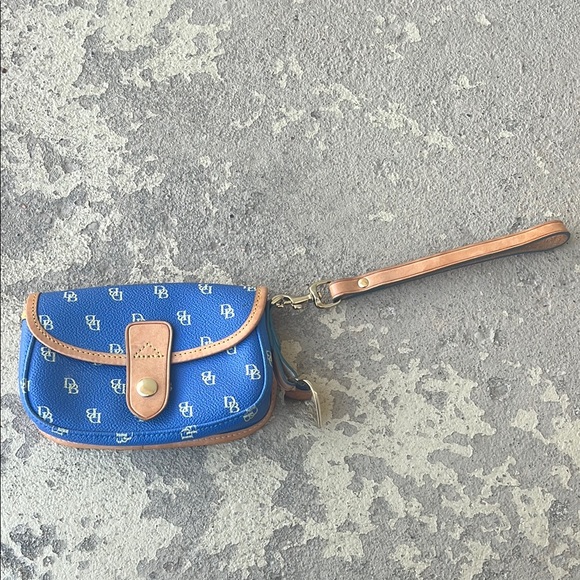 Dooney & Bourke Handbags - Like new Dooney & Bourke Blue Wristlet with Tan Trim